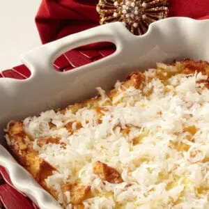 A casserole dish with shredded coconut on top.