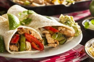 Chicken fajita wraps with peppers and guacamole