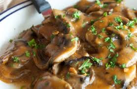Mushroom gravy on a plate with a fork.