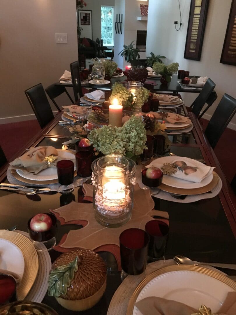 A dining room table is set for thanksgiving with catering.