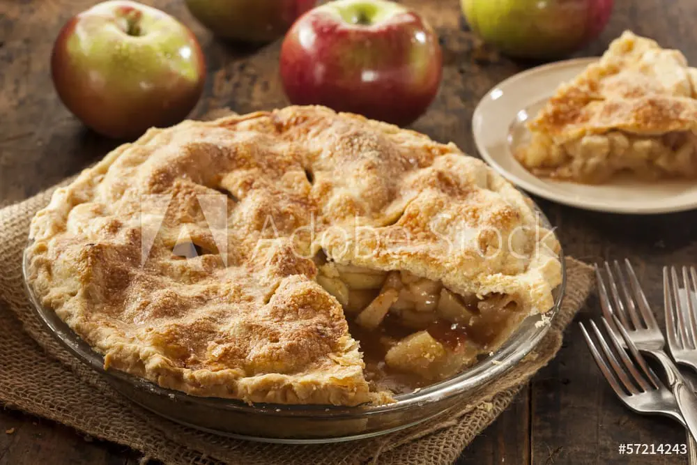 Apple pie with a slice taken out.