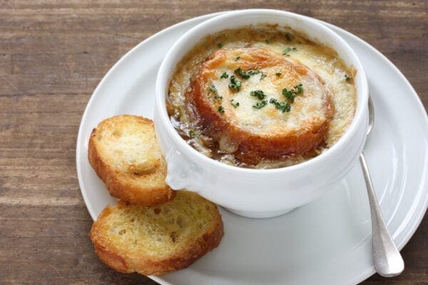 French onion soup in a white bowl.