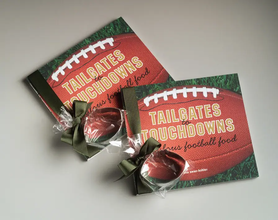 Two books with footballs on their covers.